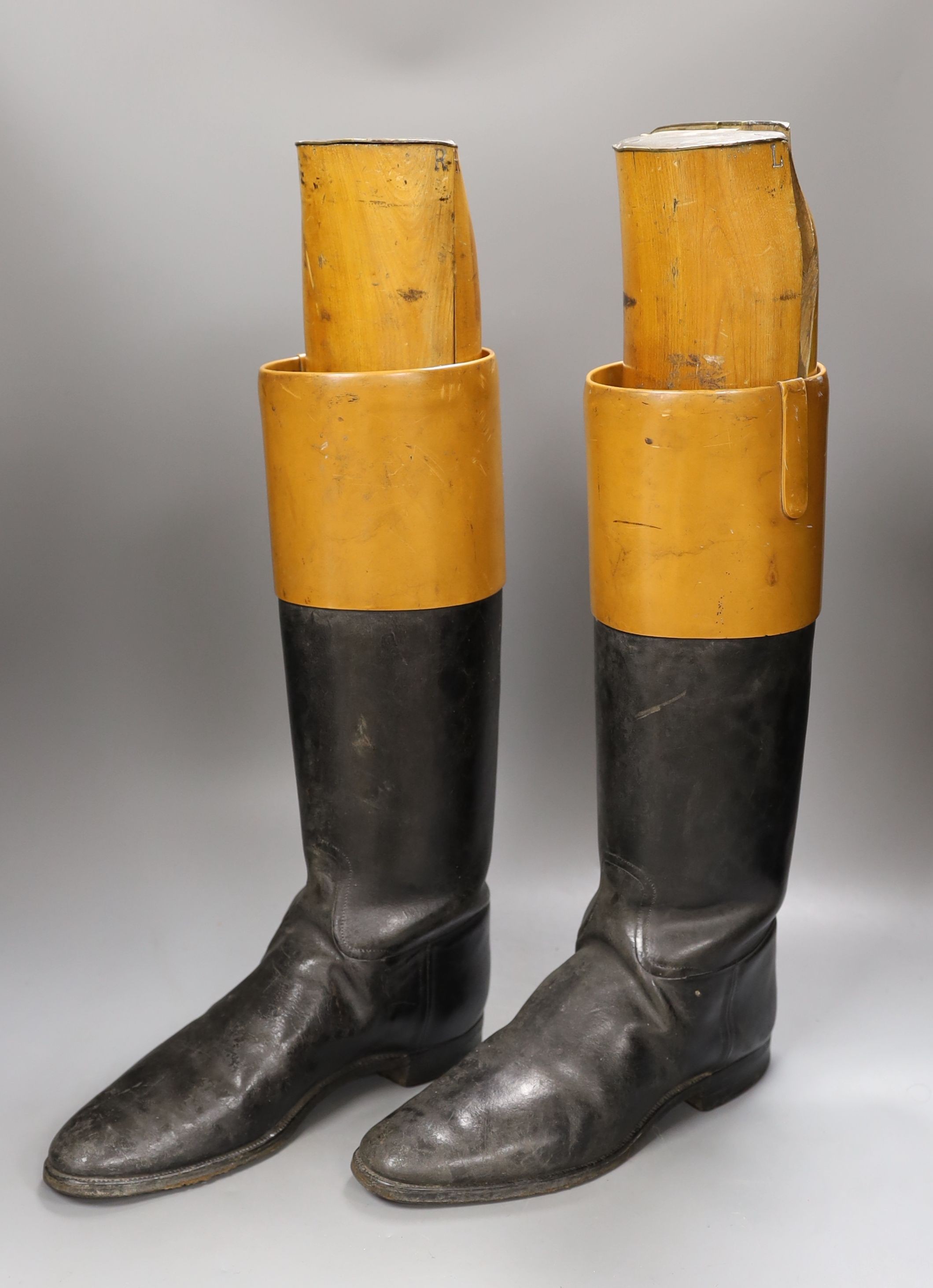 A pair of vintage leather riding boots with beech wood boot trees by Seadon Bros, St. James’s, mounted with engraved brass plates. height of trees 52 cms. *This lot is being sold in aid of the charity Prostate Cancer UK
